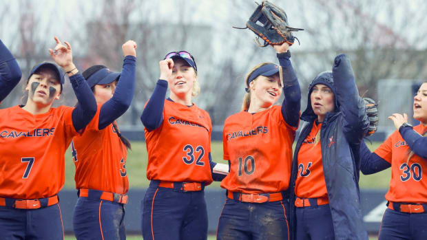 The Virginia softball team celebrates after defeating Lehigh at Palmer Park.